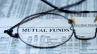 Mutual funds investment fees returns newspaper reading glasses